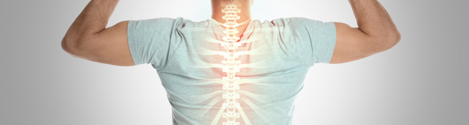 Man with healthy back on light background. Spine pain prevention