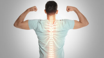 Man with healthy back on light background. Spine pain prevention