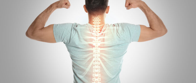 Man with healthy back on light background. Spine pain prevention